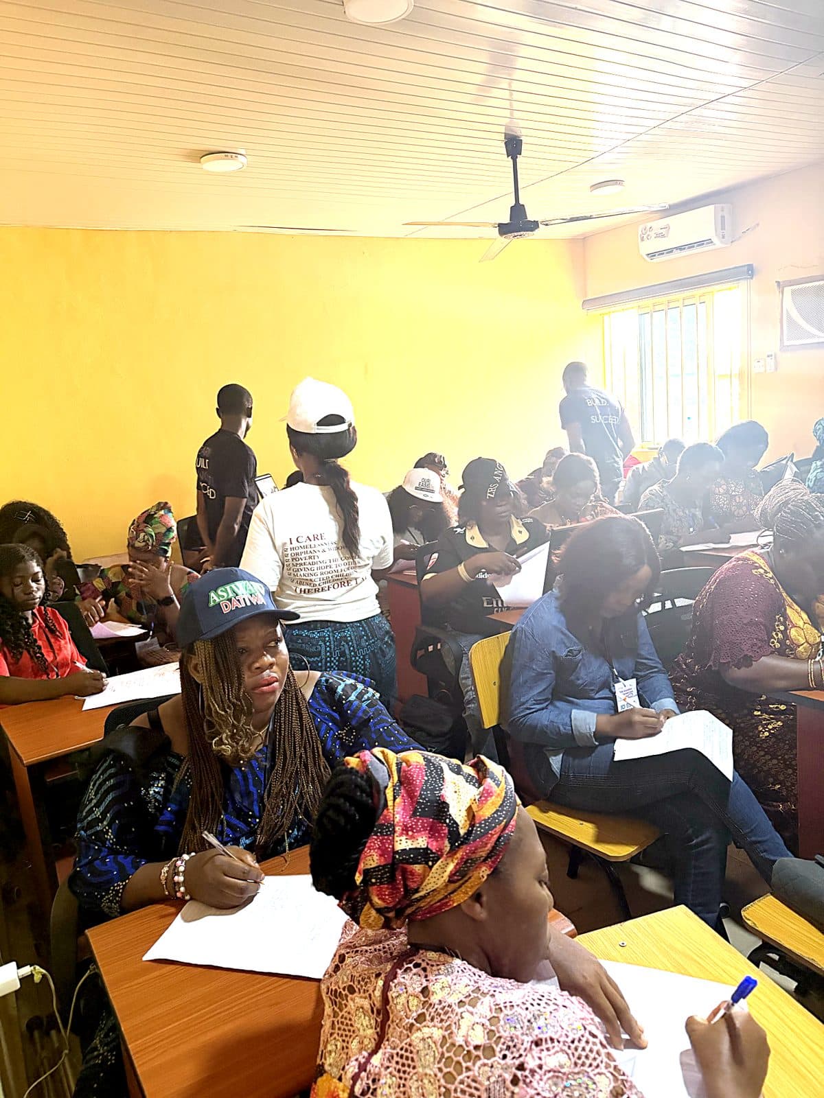 A full Nova training classroom with learners taking notes during a session
